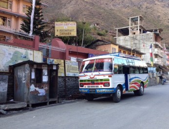 The super express bus in Syabrubesi. The small metal shack in the left of the frame is where you can purchase bus tickets back to Kathmandu.