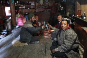 Gatlang men drinking homemade raksi on Tamang New Year.